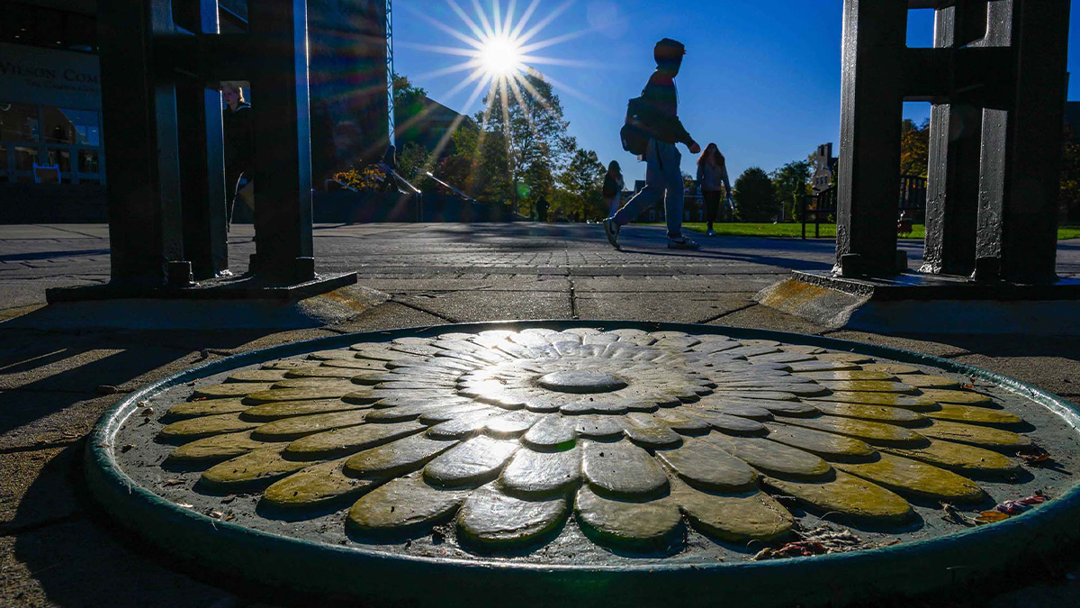 Student walking on URochester Campus (URochester photo / J. Adam Fenster)