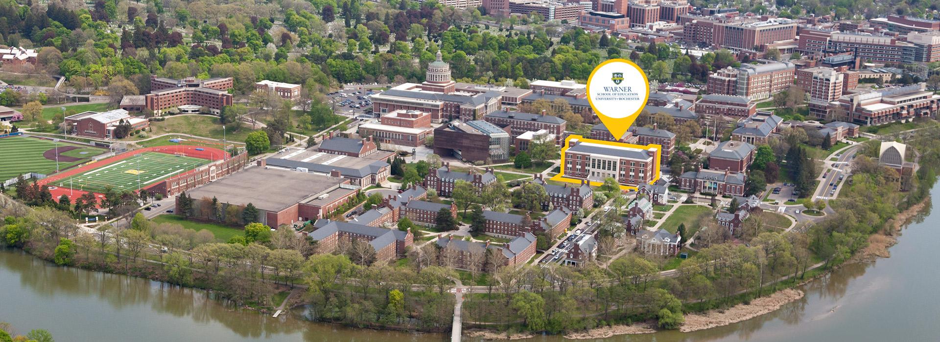 LeChase Hall highlighted in an aerial view photo of University of Rochester's River Campus