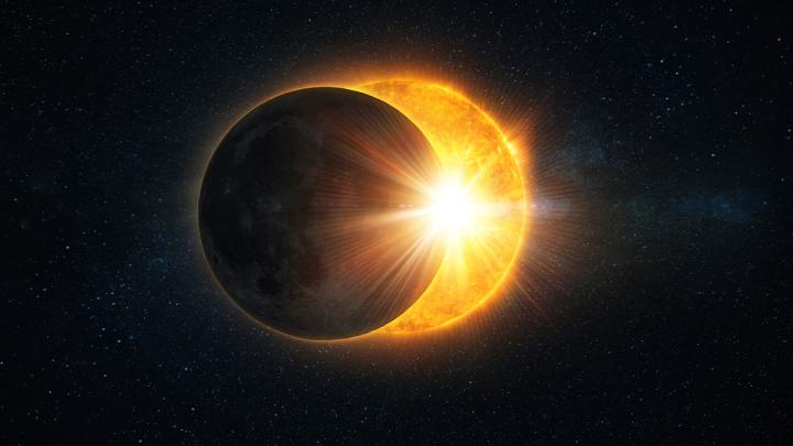 Solar eclipse rays on a light starry sky