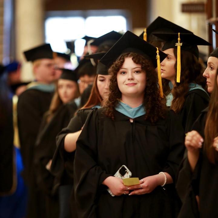 2024 graduates lining up for commencement procession
